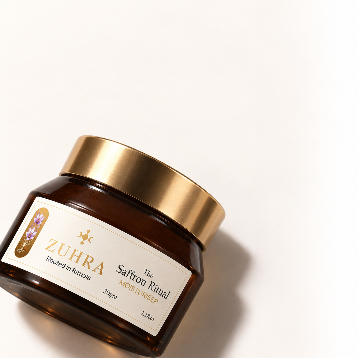 ZUHRA Saffron Face Moisturiser jar, angled, showing The Saffron Ritual label
