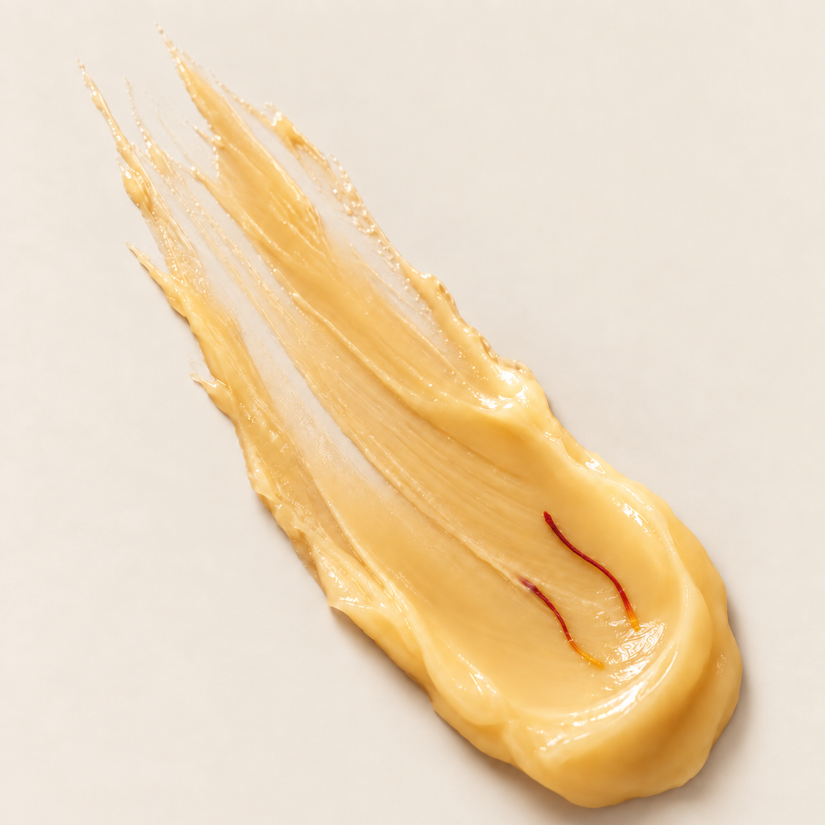 Texture of ZUHRA Saffron Face Moisturiser, a rich golden cream