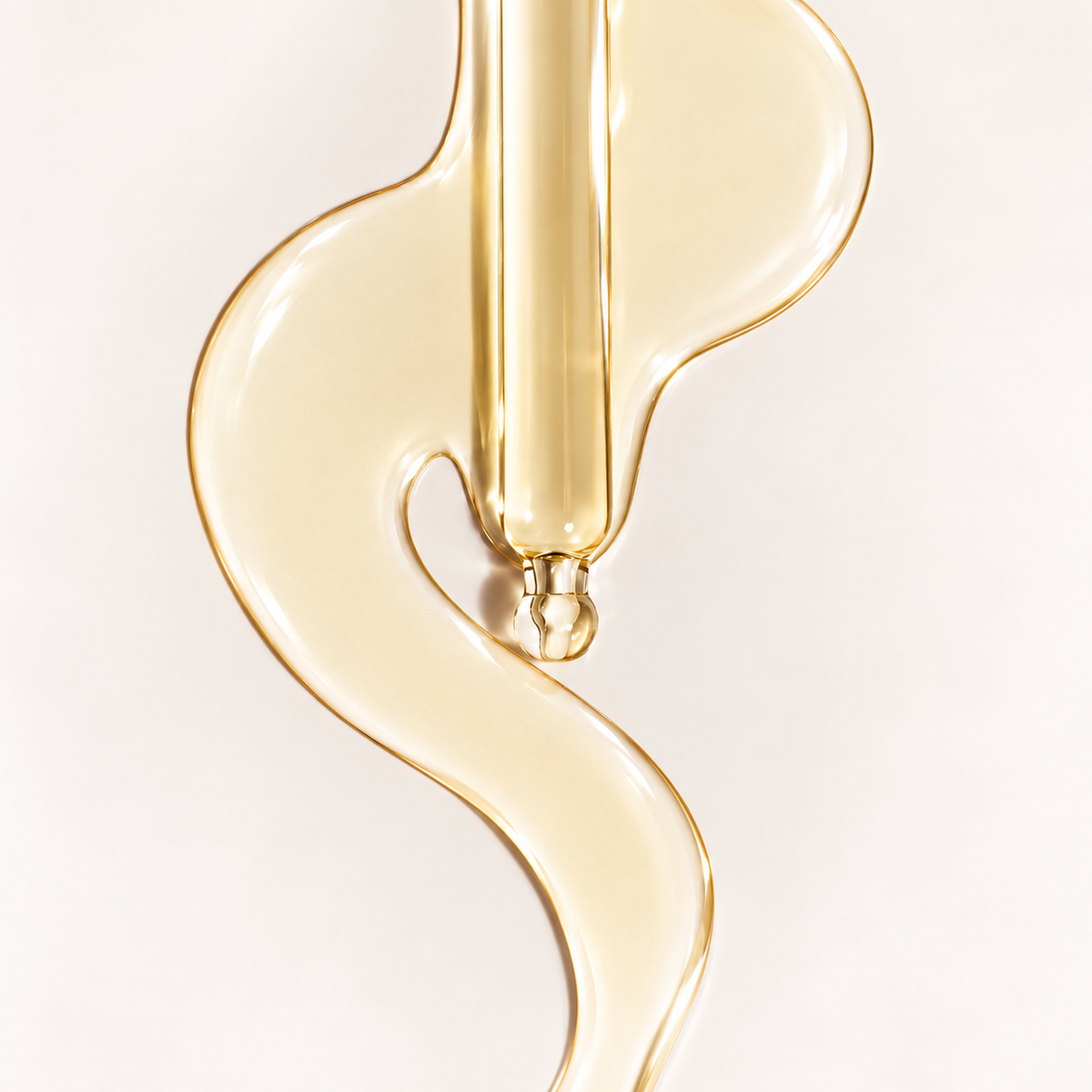 Texture of ZUHRA Saffron Serum, a golden fluid drawn from the dropper